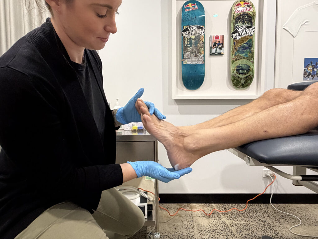 Application of urea-based moisturising therapy as part of cracked heels treatment in Melbourne CBD.