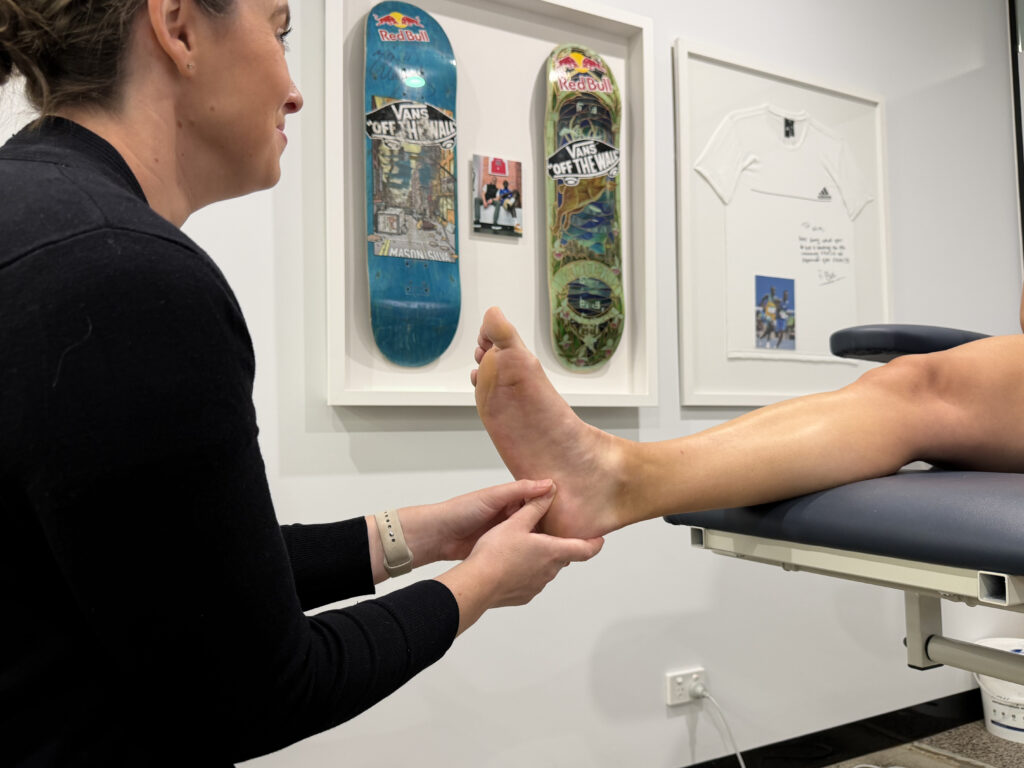 Location of heel pain commonly associated with plantar fasciitis