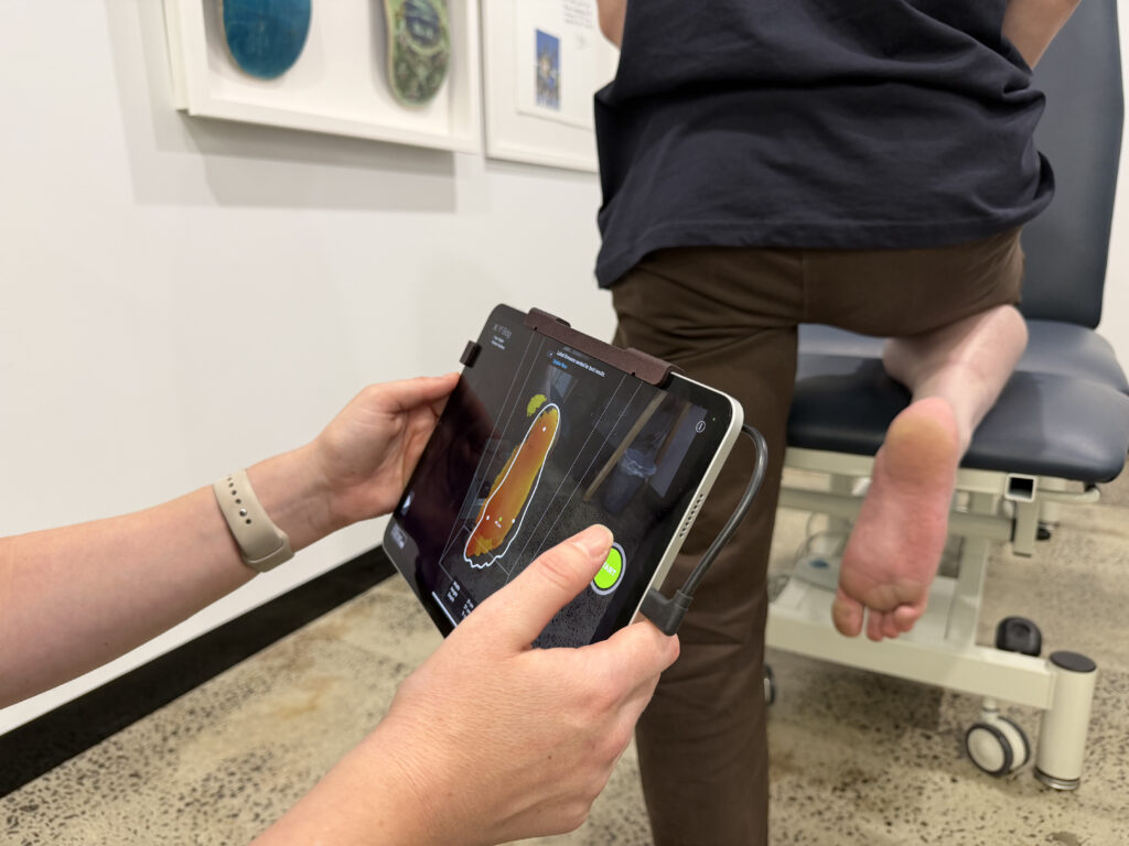 Digital foot scanning technology used by a podiatrist to prescribe custom orthotics