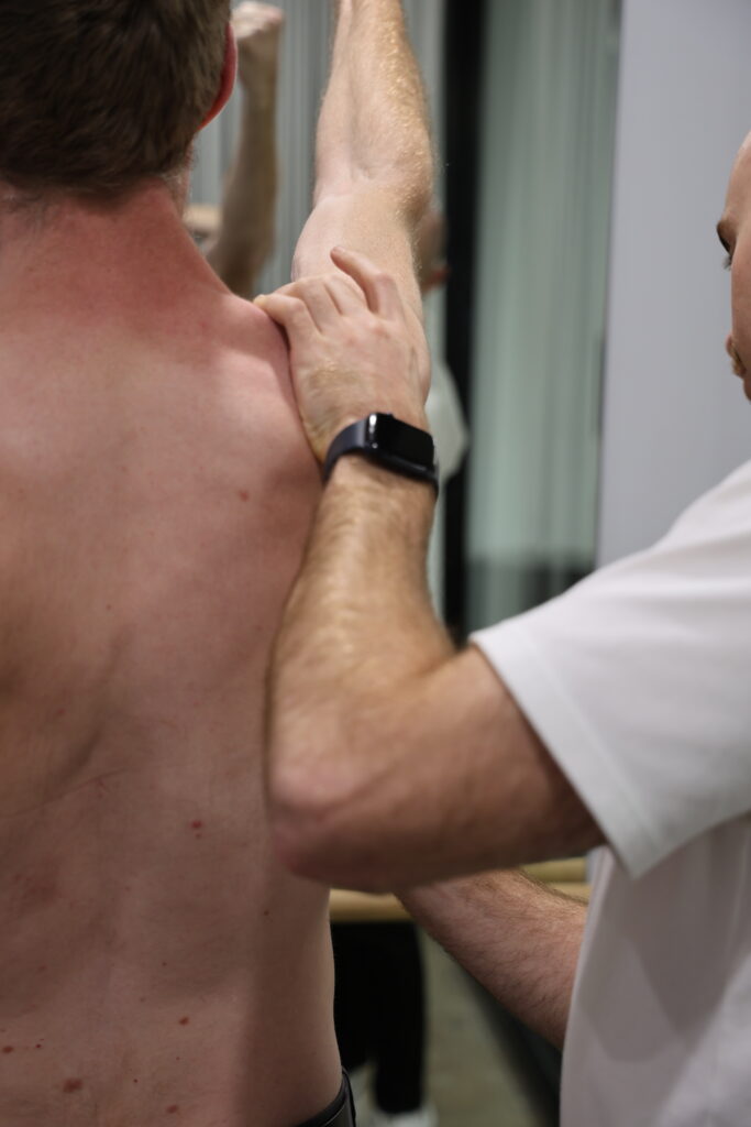 Physiotherapist assessing shoulder instability at Melbourne CBD Physio
